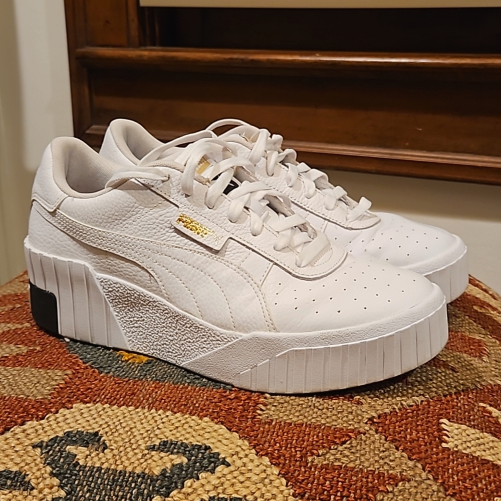 Puma Cali Wedge sneakers in white and black